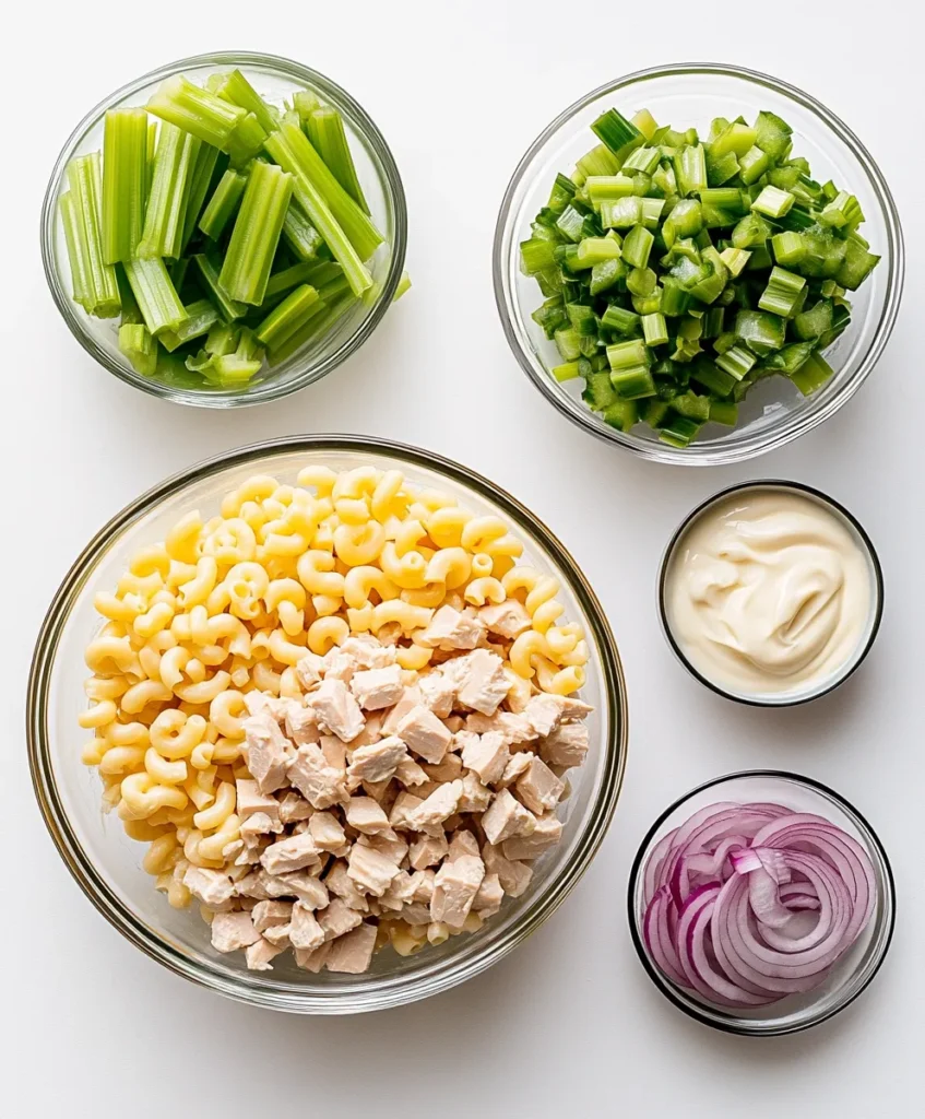 Tuna macaroni salad 2 Tuna macaroni salad ingredients on rustic counter