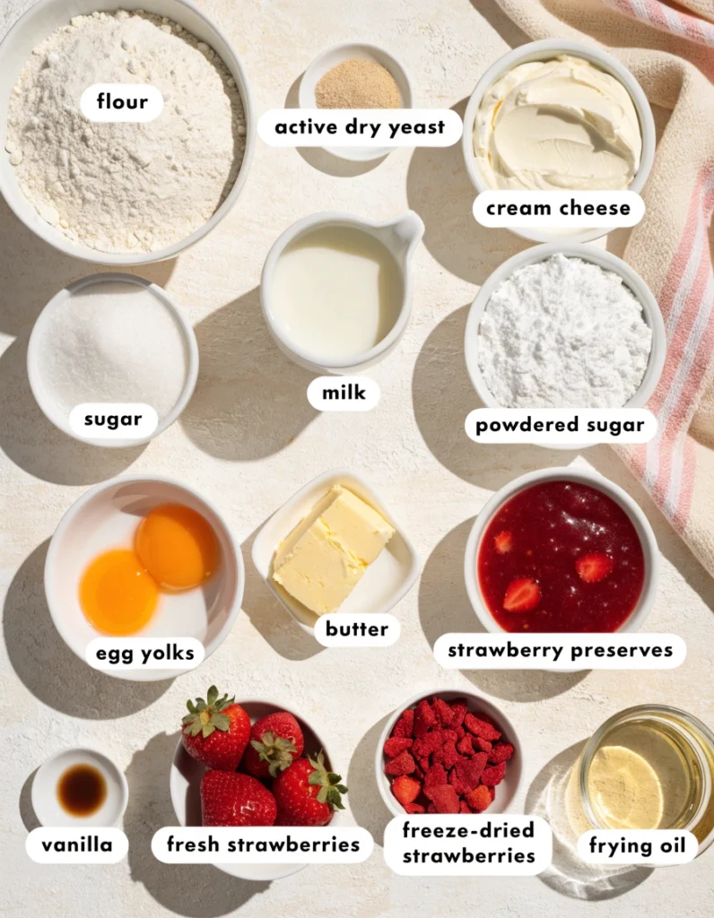 Strawberry Cheesecake Stuffed Donuts 2 Ingredients for strawberry cheesecake stuffed donuts arranged in bowls on a light background